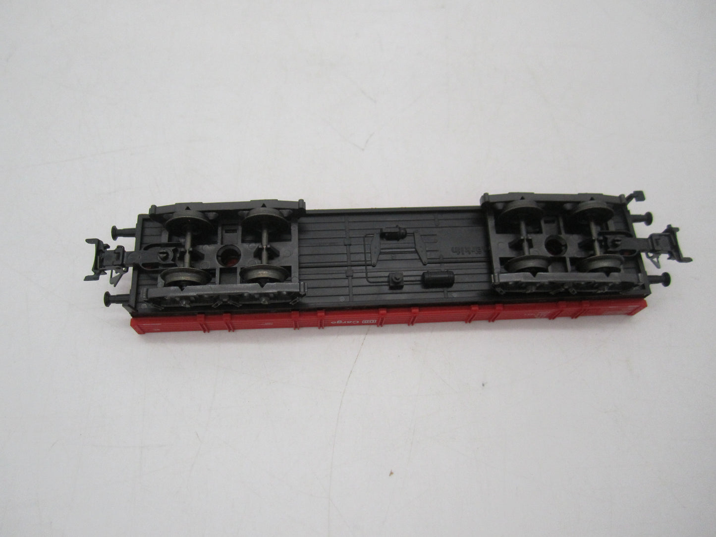 Märklin H0 - Uit set 44504 - 4-assige lageboordwagen in rood van de DB Cargo