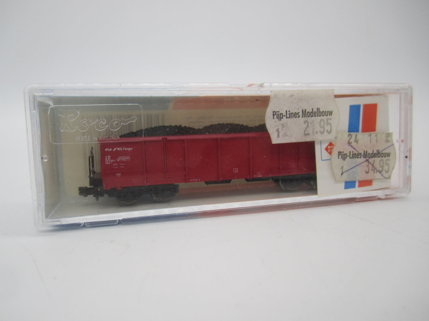 Roco N - 25258 - 4-assige lageboordwagen, met lading van de NS cargo