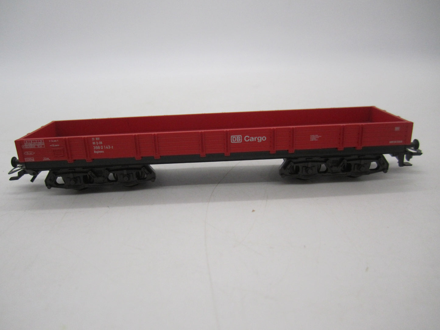 Märklin H0 - Uit set 44504 - 4-assige lageboordwagen in rood van de DB Cargo